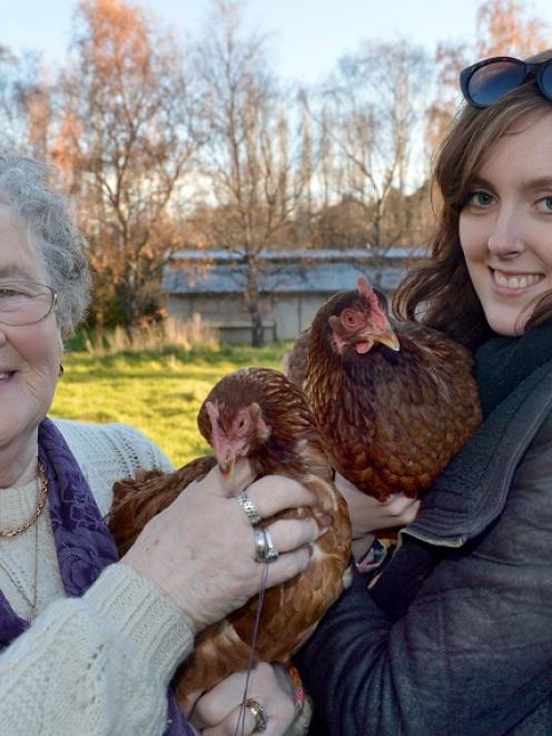 Holding hens for sale in Mosgiel yesterday are Brougham Park Poultry Farm owner Chris Wilson (L)...