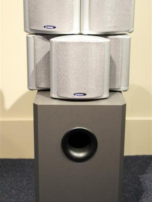 Home theatre equipment, a subwoofer and satellite speakers. Photo by Craig Baxter.