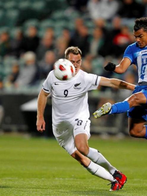 Honduras Mario Martinez, right, kicks the ball past New Zealand's Shane Smeltz. Credit: NZPA /...