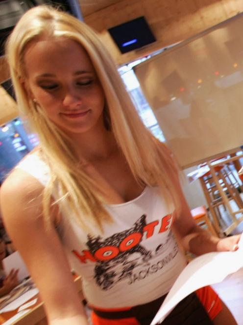 Hooters staff must wear short shorts and low cut tops. Photo: Getty Images