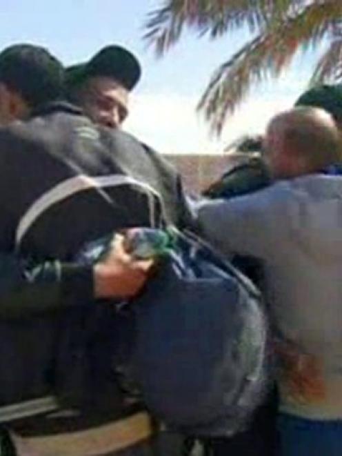 Hostages react after they were freed from a gas facility in Algeria where Islamist militants were...