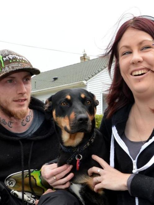Housing New Zealand tenants Lara Elliott and Shane Wilson with their dog Mischief. Photo: Stephen...