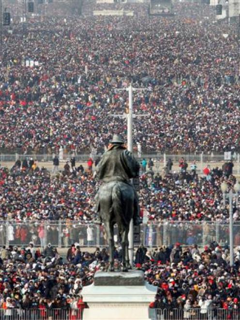 Huge crowds gather on the National Mall in Washington for the swearing-in ceremony of President...