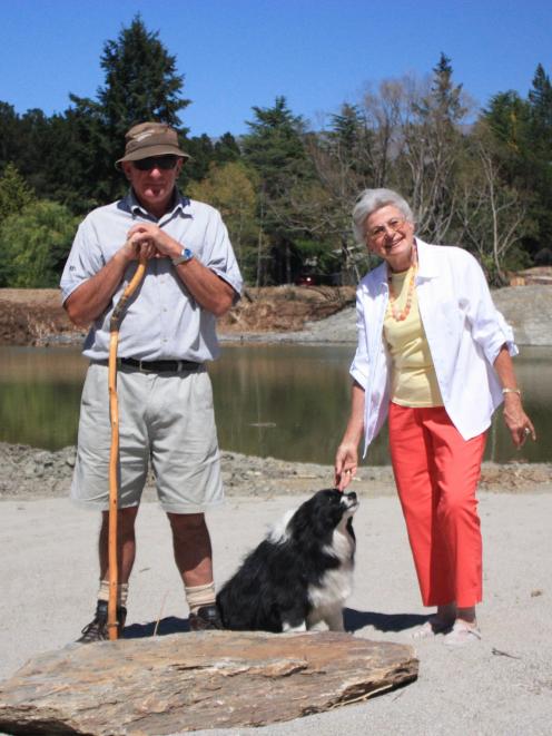 Hugh Clarke, his dog Jessie, and Ingrid Mueller, inspect a refreshed Aronui Dam on Thursday....