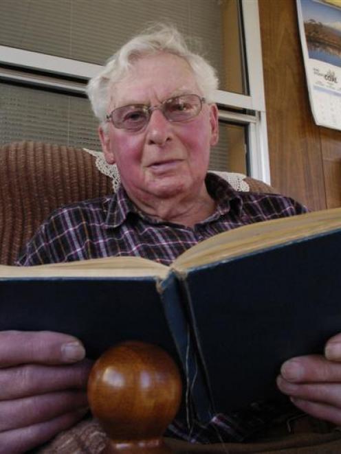 Hugh Morrison (85), of Mosgiel, reads his logbook from the period when he served as navigator in...