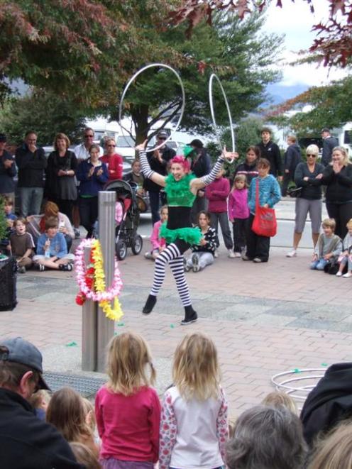 Hula-hoop contortionist Skye Broberg's street act proved popular with pedestrians on Saturday at...