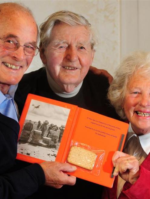 Humble biscuits brought delight to the lives of Lancaster bomber crewman Bill Hall (centre) and...