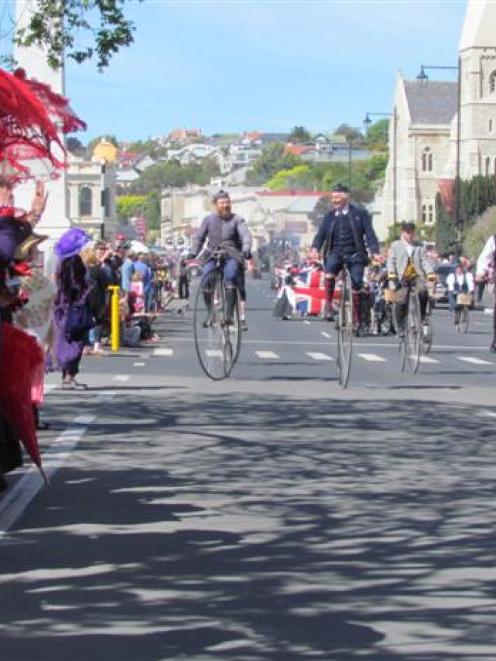 Hundreds of spectators, many in colourful outfits, line Thames St on Saturday for the Oamaru Mail...