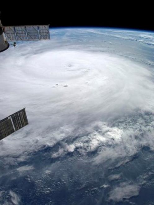 Hurricane Gonzalo is seen over the Atlantic Ocean in this NASA image taken by astronaut Alexander...