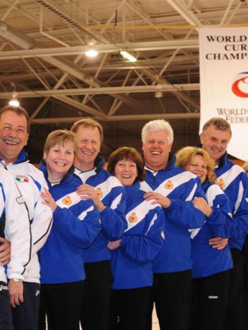 Husband-and-wife teams at the world senior curling championships in Dunedin yesterday are (from...