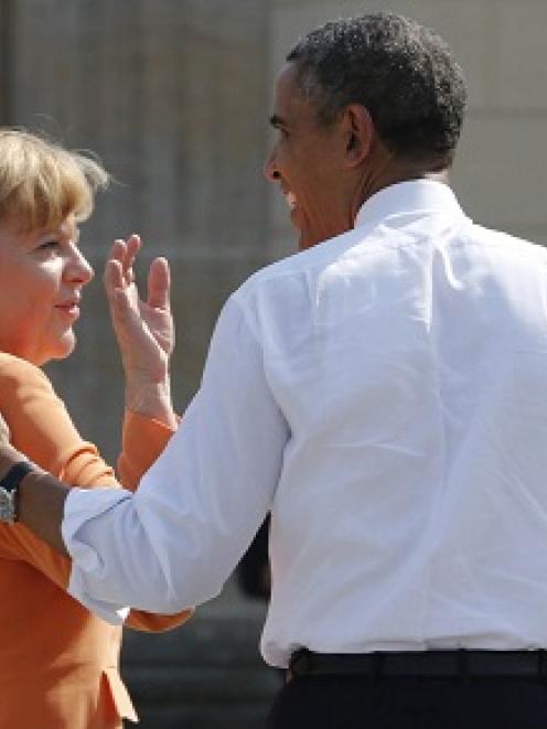 I've got your back . . . US President Barack Obama chating with German Chancellor Angela Merkel...