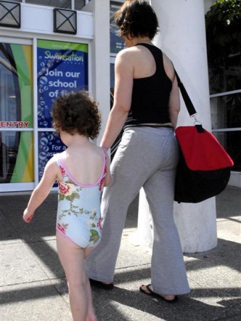 Imogen Irvine (4), with her mum Susan Irvine, could not wait to get into the water at Moana Pool,...
