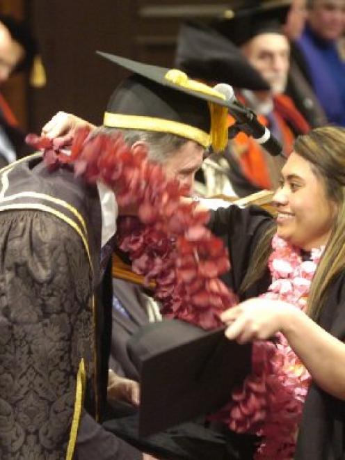 In an unusual break from tradition, graduand Taifali Leauanae puts a lei on University of Otago...