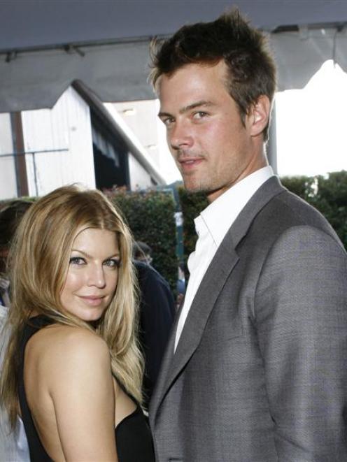 In this June 2007 picture, Fergie and Josh Duhamel arrive at the MTV Movie Awards in Los Angeles....
