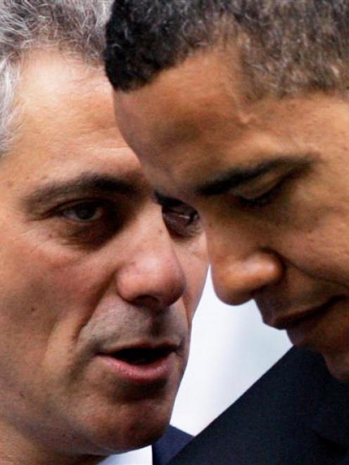 In this June 6, 2008, file photo Rep. Rahm Emanuel, D-Ill., left, huddles with then-Democratic...