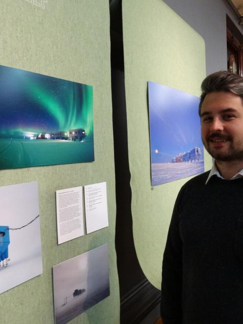 Sam Patterson, of Architecture and Design, Scotland, admires images of the British Antarctic...