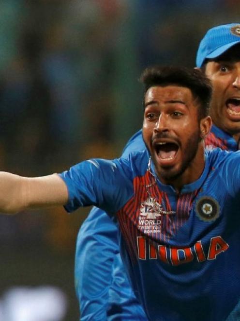 India's Hardik Pandya (L) and Yuvraj Singh celebrate their victory against Bangladesh. REUTERS...