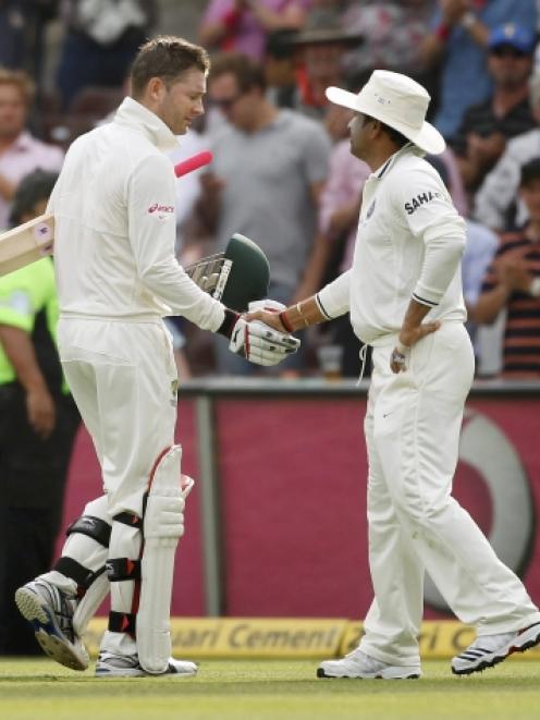 India's Sachin Tendulkar (R) shakes the hand of Australia captain Michael Clarke as he leaves the...