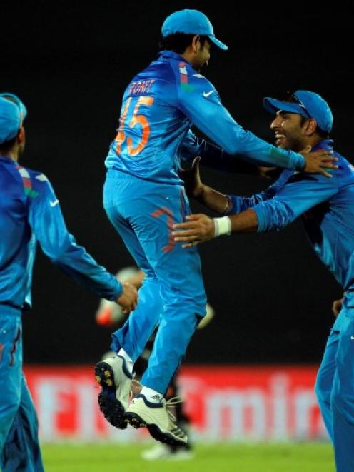 Indian players celebrate the dismissal of Australia's Shane Watson. REUTERS/Andrew Biraj
