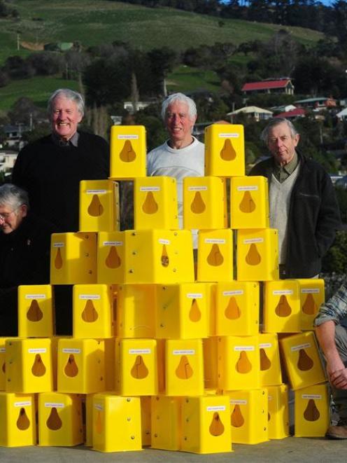 Inspecting the Timms traps to be used on Otago Peninsula yesterday  are  (from left) Irene Scurr,...