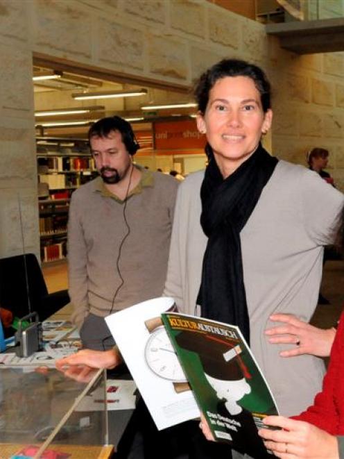 International Languages Week Dunedin  co-ordinator Dr Antonie Alm (centre) visits a display of...