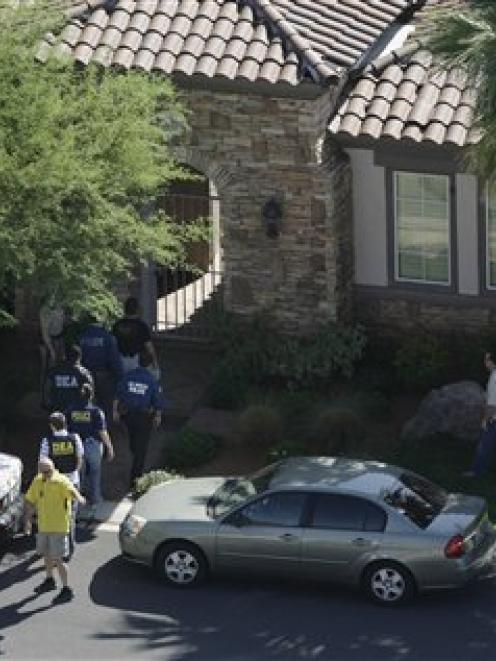 Investigators search the home of Michael Jackson physician, Dr Conrad Murray in Red Rock Country...