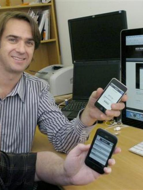 iPhone app developer George Sealy (front), Sparc high-performance consultant Richard Young (left)...
