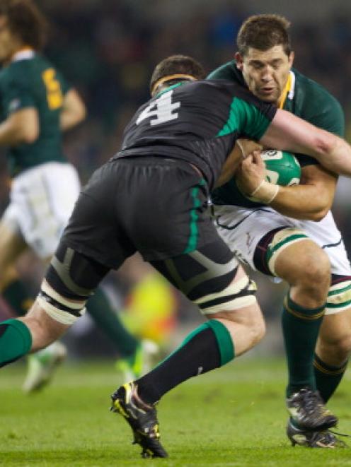 Ireland's Donnacha Ryan tackles South Africa's Willem Alberts during their rugby union test at...