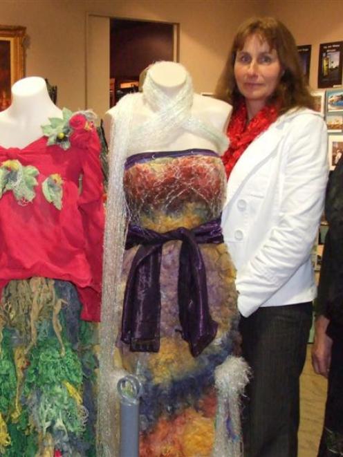 Irene Smith with one of the prize-winning WoolOn garments  displayed at Central Stories. Photo by...