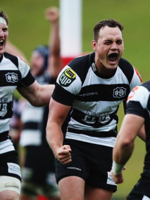 Israel Dagg (C) celebrates with Hawke's Bay teamates Ihaia West (R) and Brendon O'Connor after...