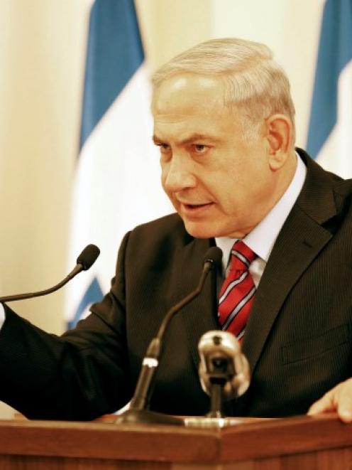 Israel's Prime Minister Benjamin Netanyahu gestures during a news conference in Tel Aviv about...