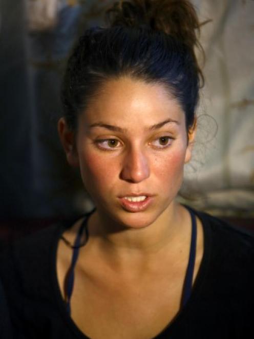 Israeli trekker Maya Ora, who was rescued by the Nepalese army after the avalanche, speaks with...