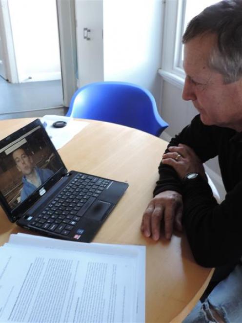 Ivan Holloway studies a video on foot-and-mouth disease at Vetlife Oamaru in preparation before ...