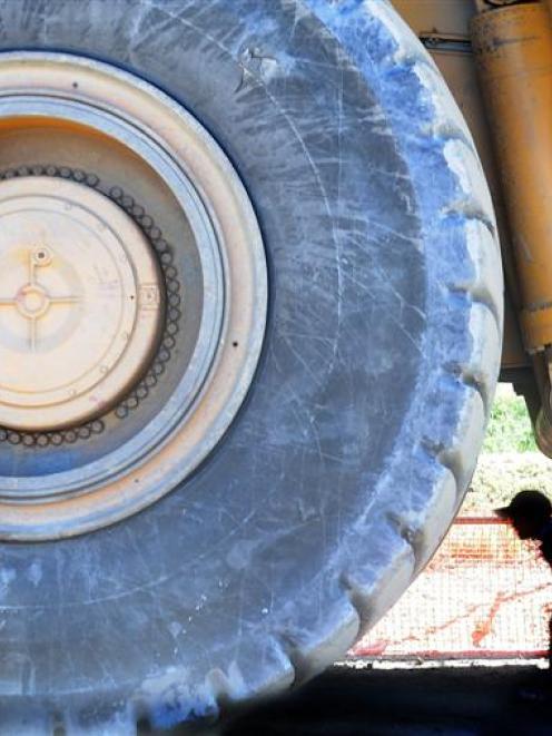Jack (7) and Cameron (4) McFarlane, of Dunedin, walk under a dump truck at the Oceania Gold's...