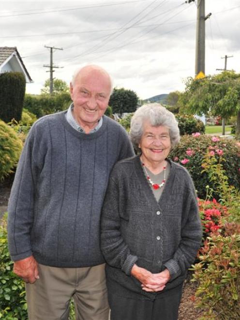 Jack and Betty Popham in the garden of their Goodall St home. Photo by Linda Robertson.