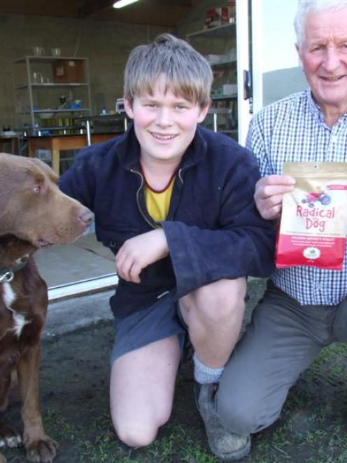 Jack Newlands (14) and his grandfather John Newlands, with Cop the dog, outside the Radical Dog...