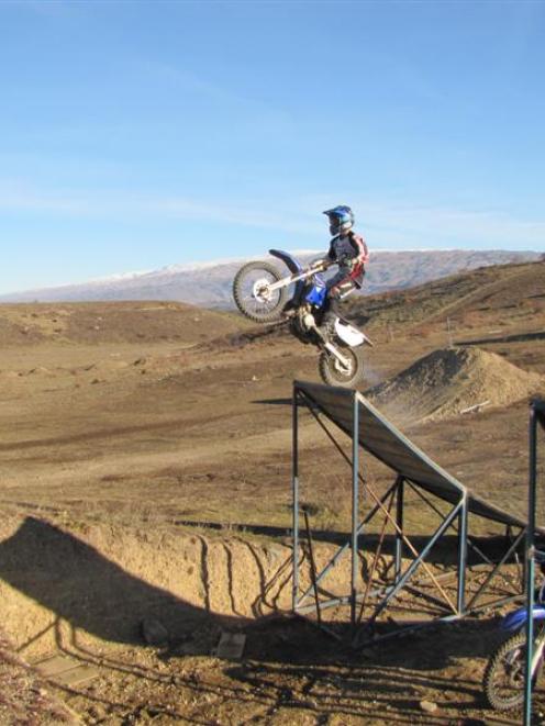Jacob Jones practises some big jumps at the Alexandra motocross facility. Photo by Sarah Marquet.
