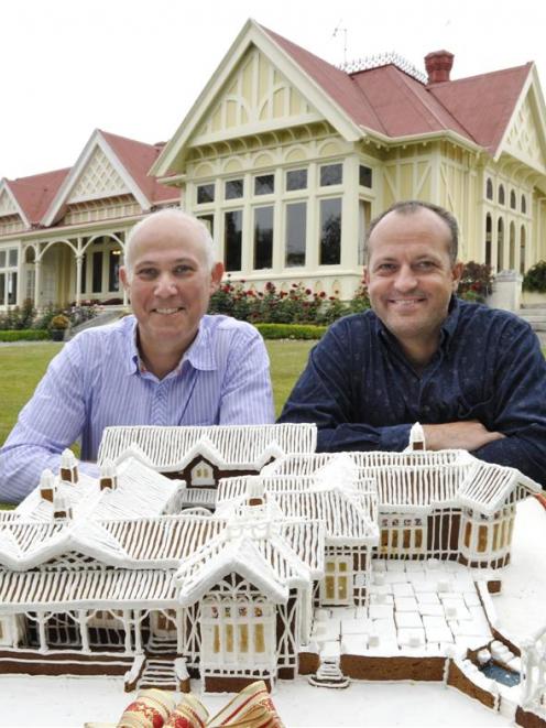 James Glucksman (left) and James Boussy with the gingerbread replica of their home Pen-y-bryn...