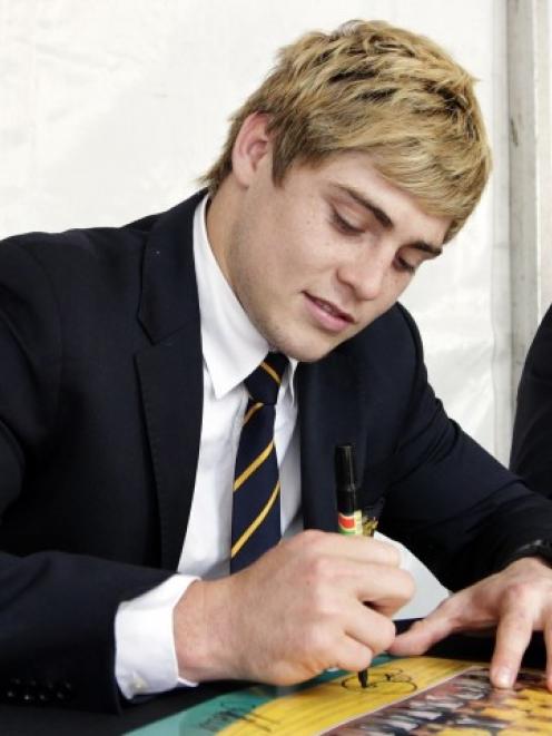 James O'Connor signs autographs at the Wallabies' farewell event in Sydney earlier this month....