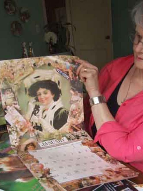 Janice McPherson with some of her calendar collection. Photo by Sally Rae.
