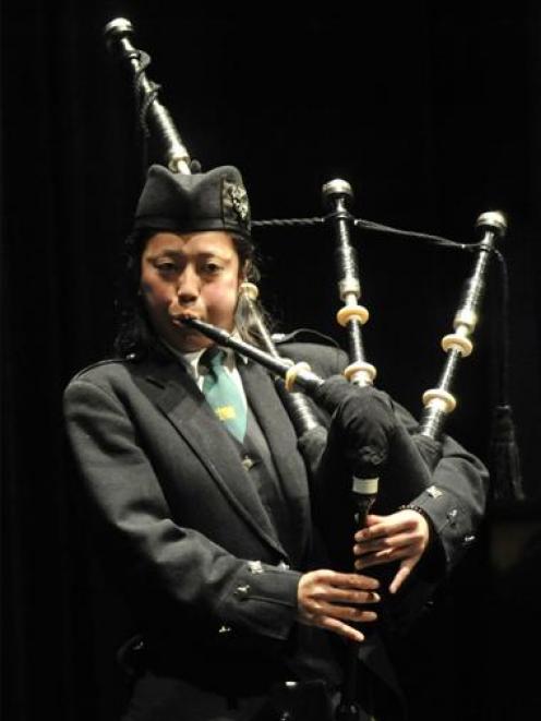 Kaho Sakakura play the bagpipes at a mayoral reception for international students at the Kings...