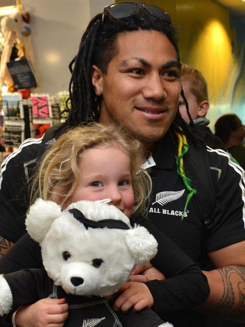 Jasmine Hill (4) enjoys a moment with   Ma'a Nonu after the All Blacks arrived in Dunedin ...