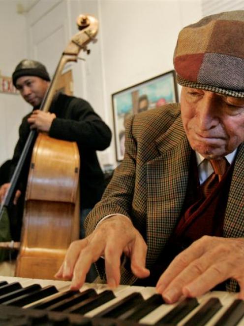 Jazz Fest founder and executive producer George Wein plays with a jazz band in New Orleans. Photo...