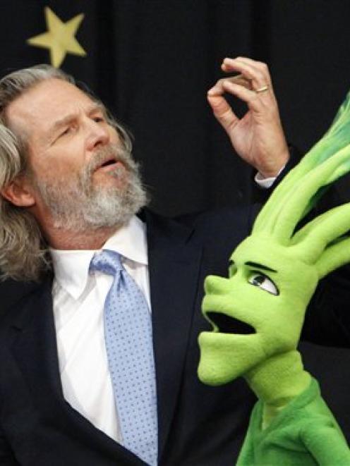 Jeff Bridges jokes with a puppet during the launch of the Virginia No Kid Hungry Campaign in...