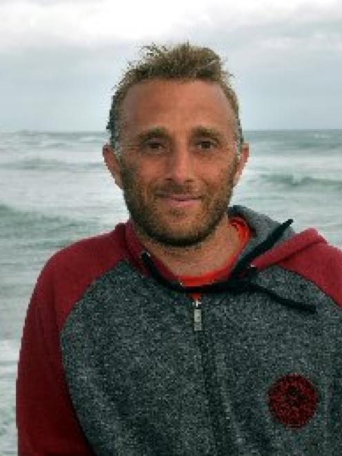 Jeff Patton at St Clair Beach where he rescued a surfer yesterday. Photo by Stephen Jaquiery.