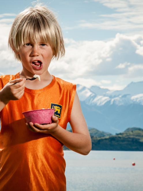 Jem Curtis (9) enjoys a Black Peak Gelato in a compostable PotatoPak container. Under San...