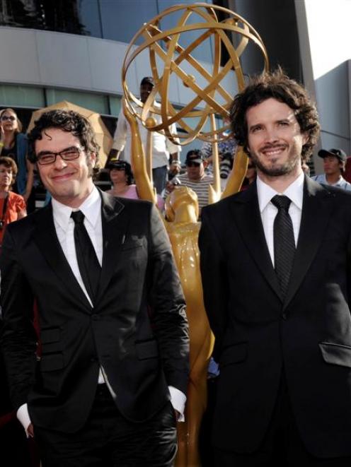 Jemaine Clement, centre, and Bret McKenzie, right, stars of 'The Flight of the Conchords' arrive...