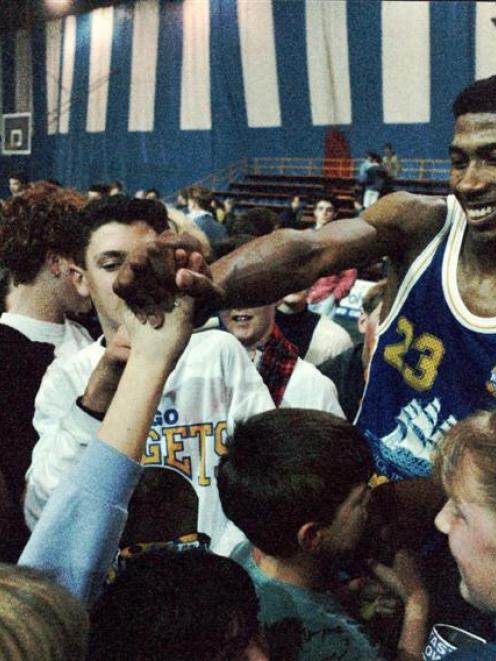 Jerome Fitchett celebrates with Nuggets fans. Photo from <i>ODT</i> Files.