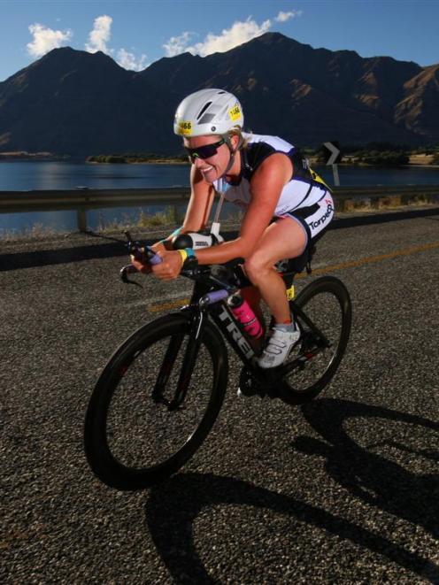 Jess Simson on her way to second place in the Challenge Wanaka half-ironman.  Photo by marathon...