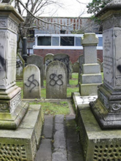 Jewish graves were desecrated with Nazi emblems at the Grafton Cemetery on Karangahape Rd. Photo...